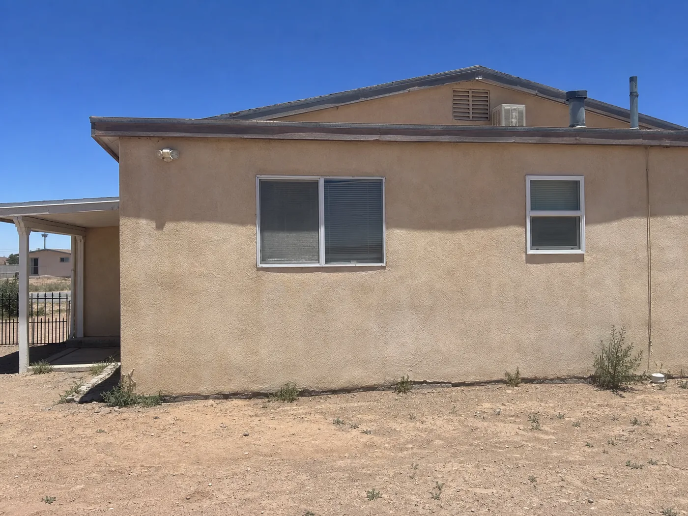 House painting Artesia New Mexico Eddy County stucco sun-bleached exterior before repaint